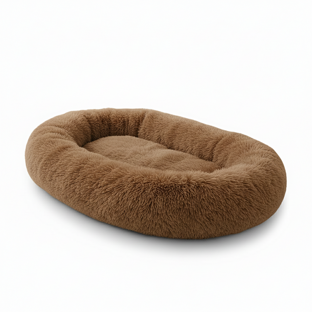 Plush brown oval dog bed with fluffy, soft fabric on a white background.