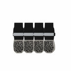 Set of four black and gray non-slip pet socks with paw grip pattern and reflective straps.