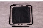Disassembled elevated pet bed frame with mesh fabric and assembly hardware on gray floor