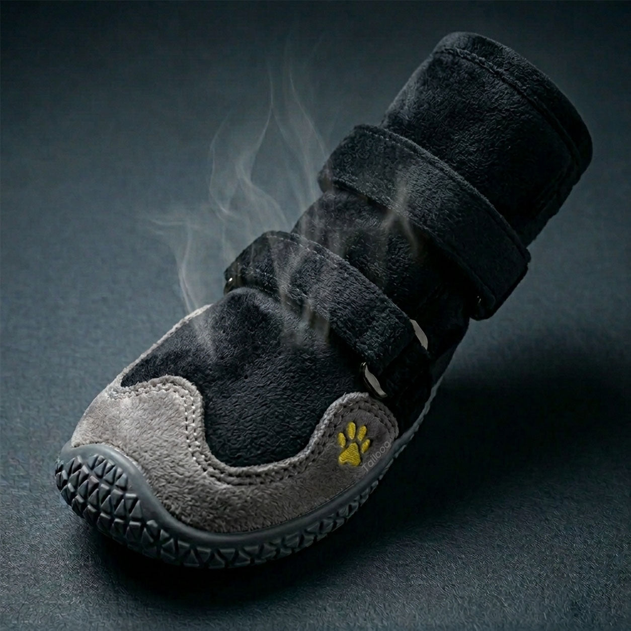 Tailooo dog boot with plush inner lining shown open with steam rising from the top, highlighting warm and breathable interior construction.