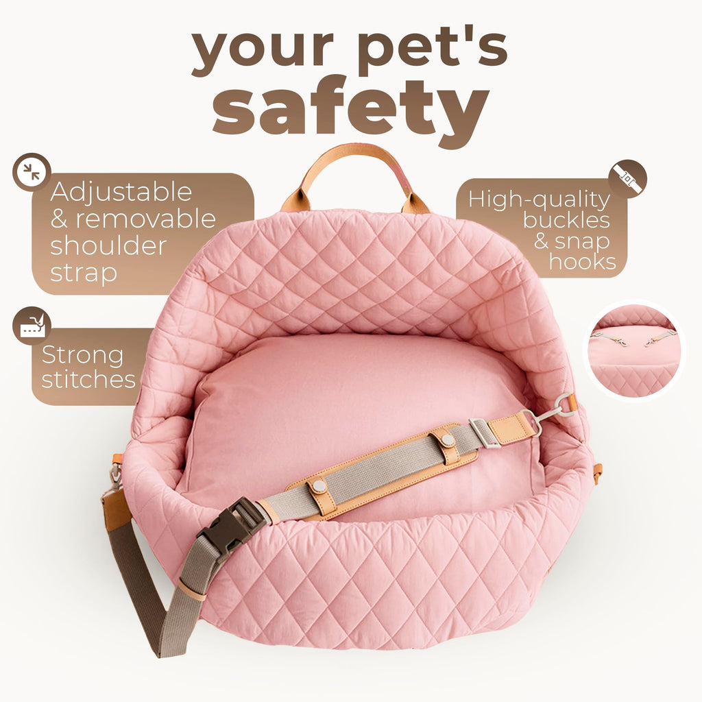 Close-up of the waterproof pink oxford fabric and internal safety clip in the dog car seat for maximum protection.