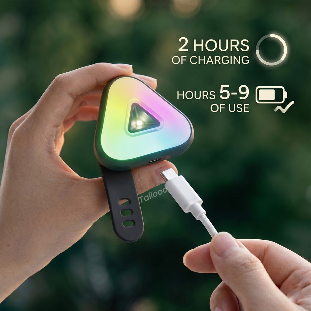 Hands holding a Tailooo RGB dog collar light being charged via USB-C cable, with text showing 2 hours charging time and 5–9 hours battery life.