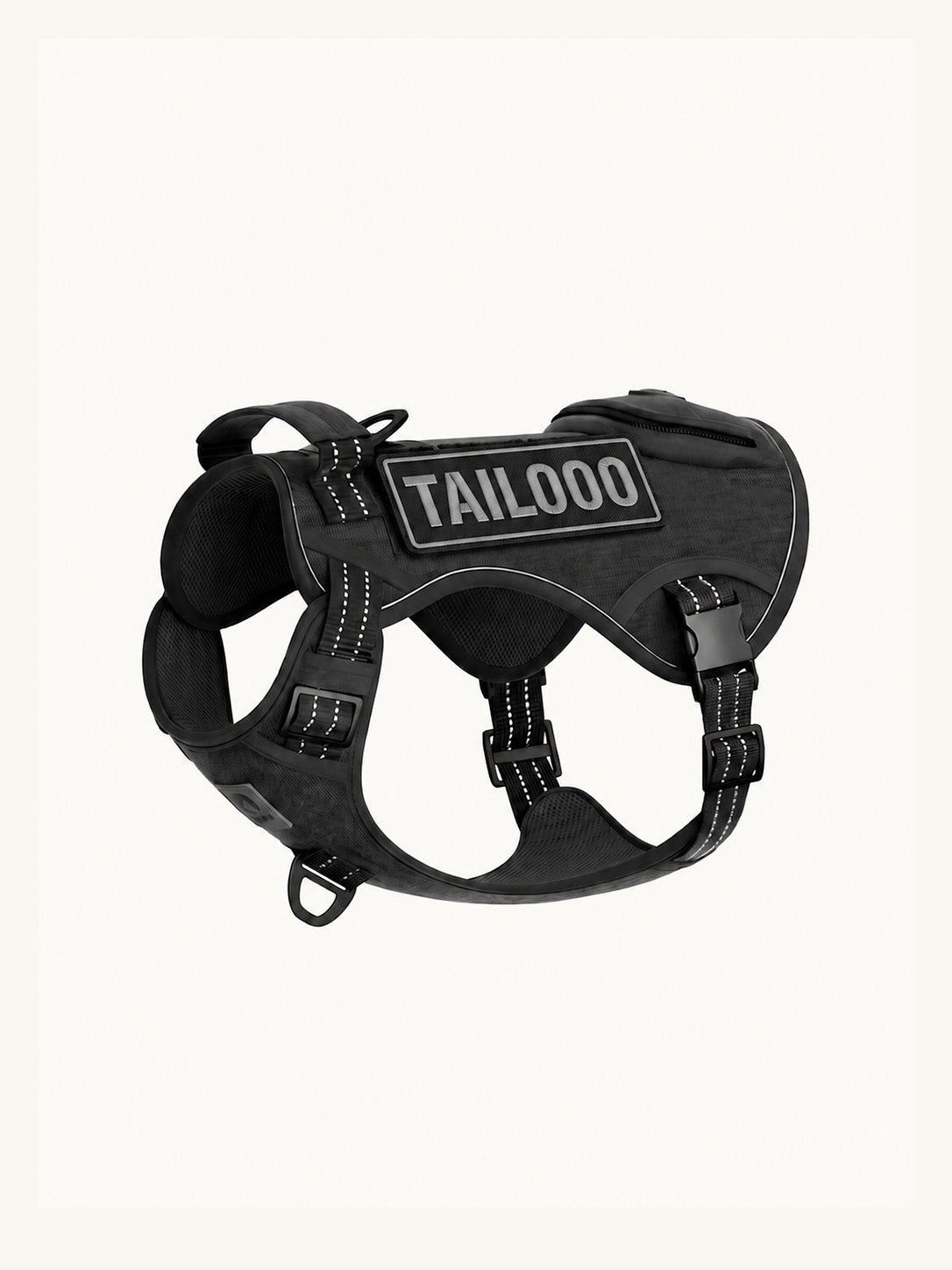 Isolated black tactical dog harness with reflective stitching, a no-pull easy walk dog harness with multiple D-rings for leash attachments.