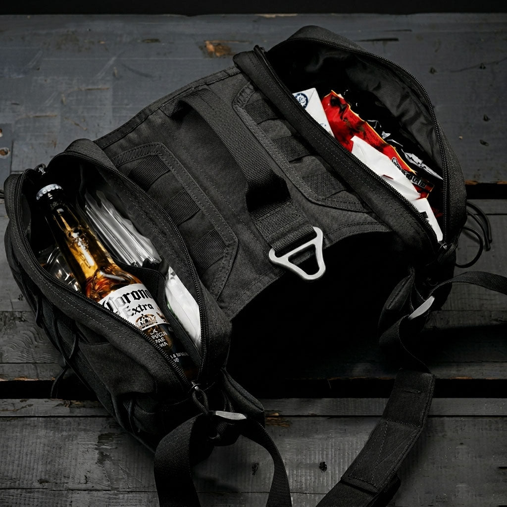 Tailooo dog hiking pack with both side pouches open showing large capacity storage with bottles and snacks, and elastic bungee cord retention system on wooden surface.