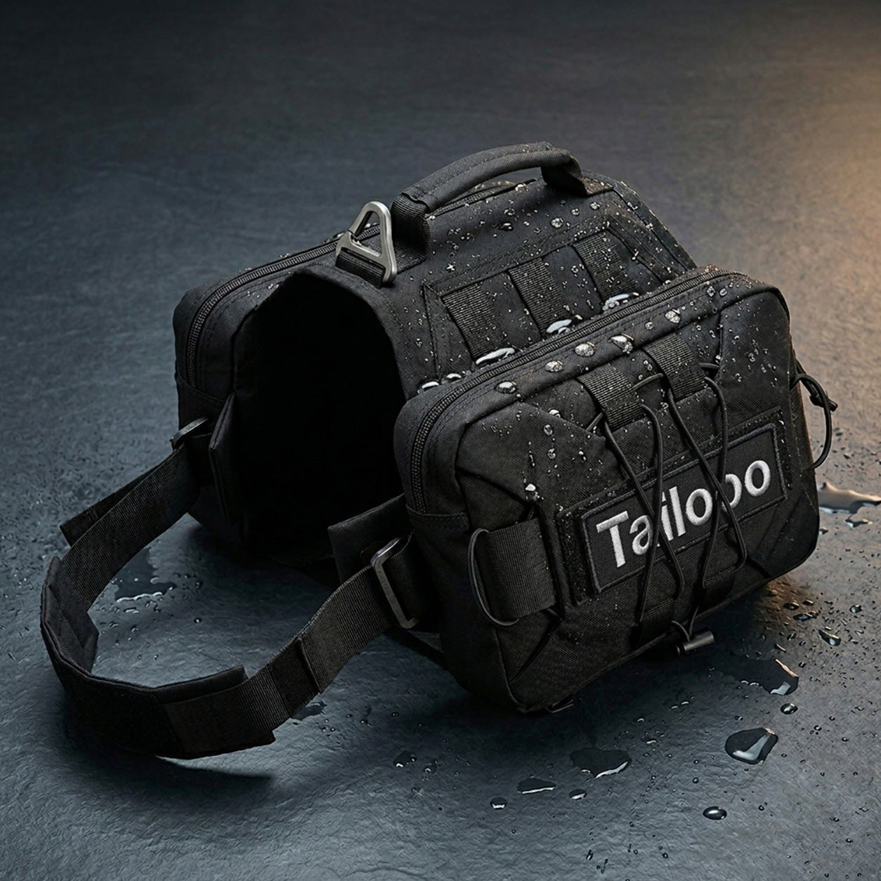 Tailooo black dog hiking pack covered in water droplets on a wet dark surface, showing waterproof oxford fabric and MOLLE webbing construction.