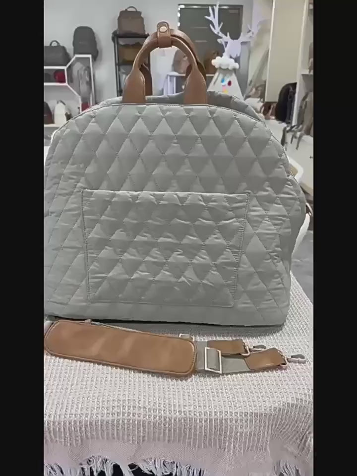 Watch how the 2-in-1 Dog Car Seat keeps your pet safe and comfortable. Features easy installation, waterproof pink fabric, and transition to a shoulder carrier. Perfect for small dogs on road trips.