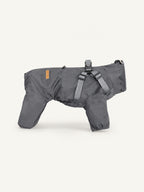 Full-body dog rain coat with built-in harness, waterproof and windproof dog apparel for all-weather outdoor use.