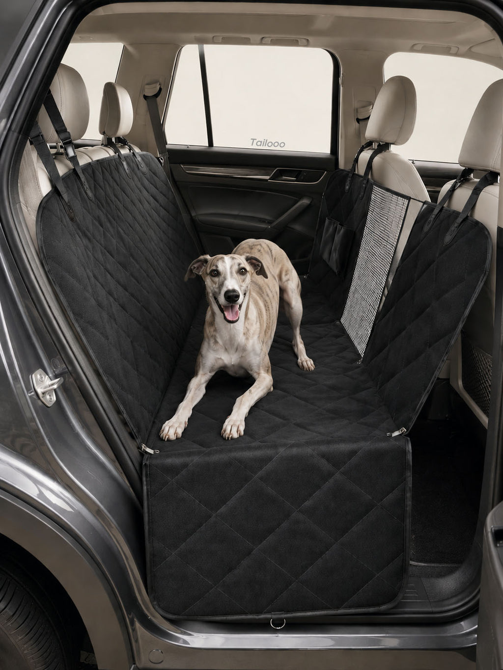 Whippet resting comfortably on a quilted waterproof dog car seat, a durable dog safety seat for car travel to protect your backseat.