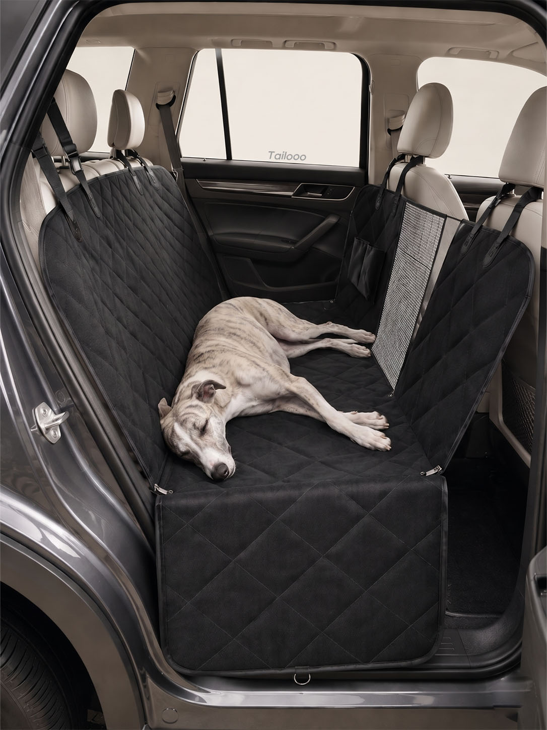 Whippet sleeping on a quilted dog car seat cover, highlighting the soft, supportive padding of this dog safety seat for car.